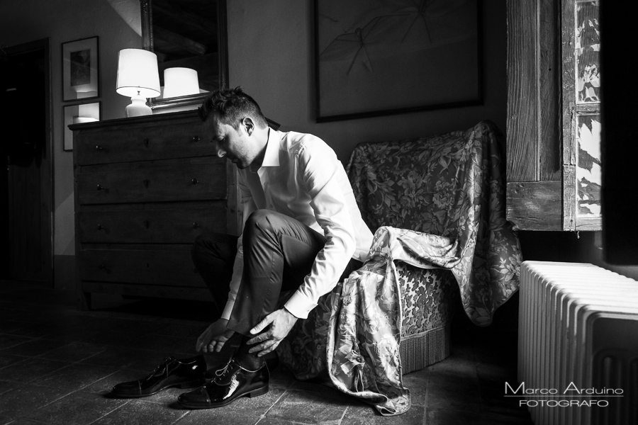 groom getting ready castle San Sebastiano Po Italy